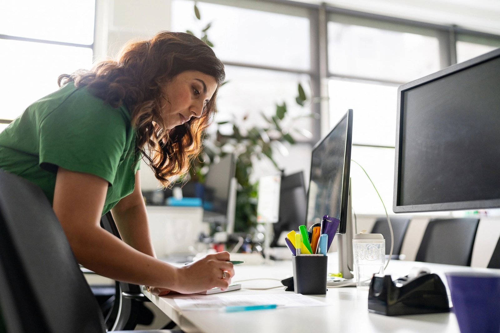 Technology professional working at a modern office desk